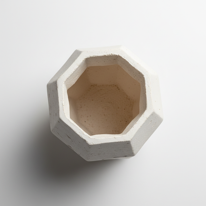 Top-down view of ceramic geometric vase showing opening and texture